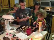 Connor, Logan, Mary Collynn and Mom making cookies in the kitchen